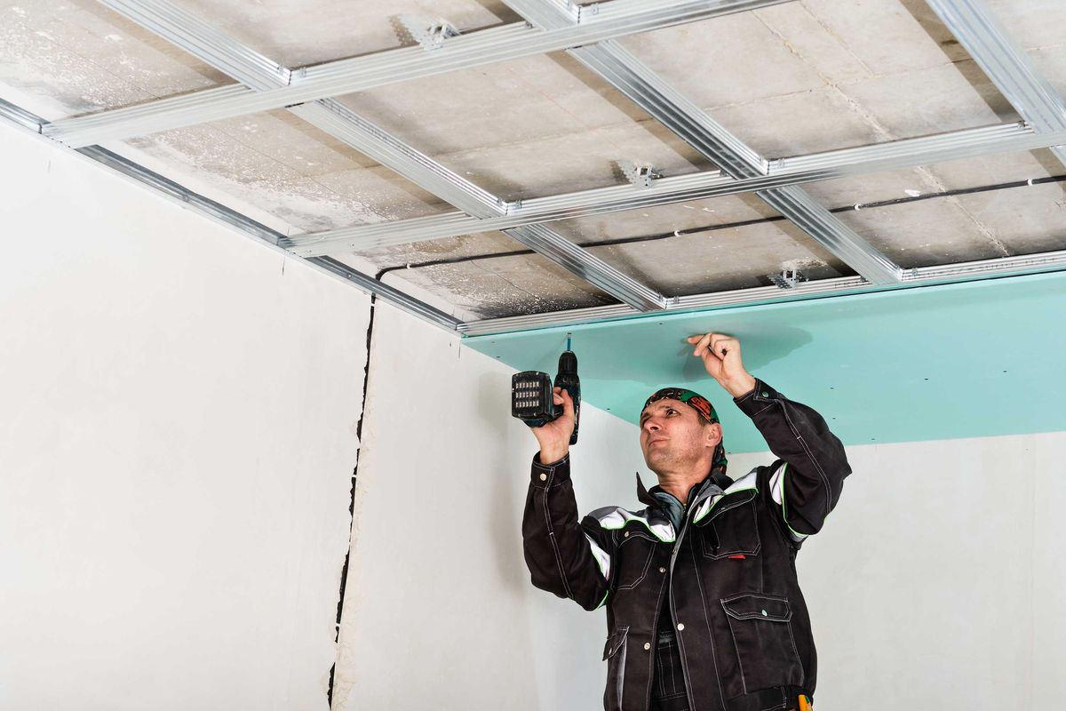 Plasterer smoothing a wall
